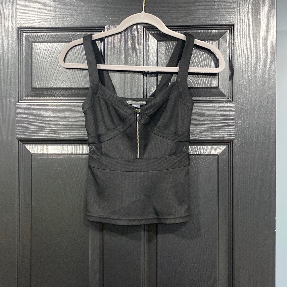 Woman’s Armani Exchange tank top.With see through side, and working zipper front